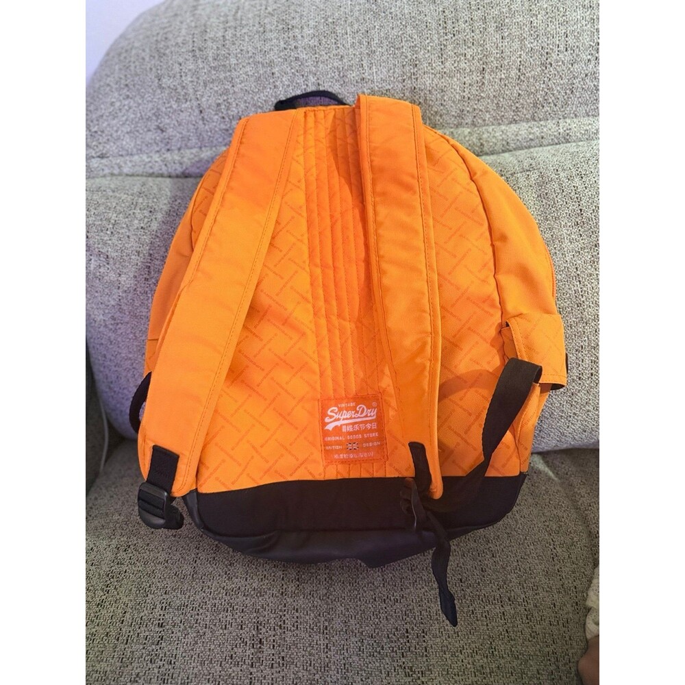 This orange Superdry Men Brand Logo Backpack features a high-build, embossed log - Picture 2 of 3